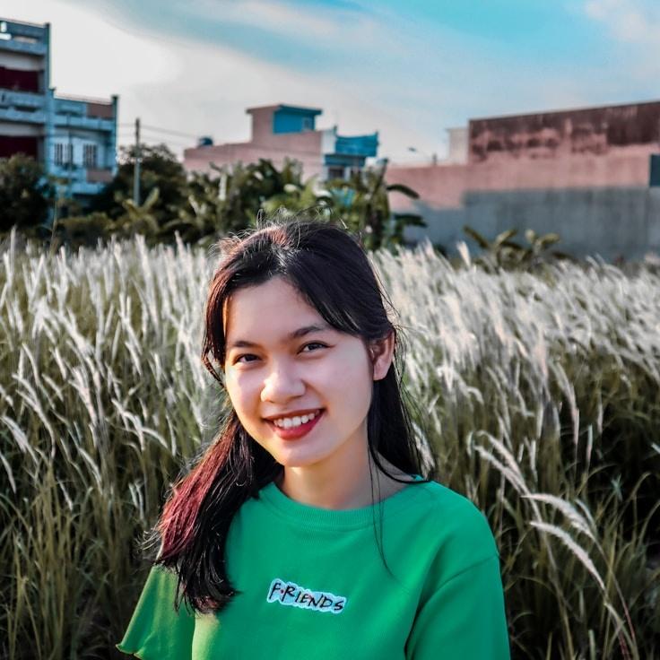 Avery Chen, Lead Design Curator at CobaltGardenTrail, reviewing corporate floral arrangements